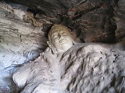 256px-60_buddha_head_carved_into_living_rock_9121945101
